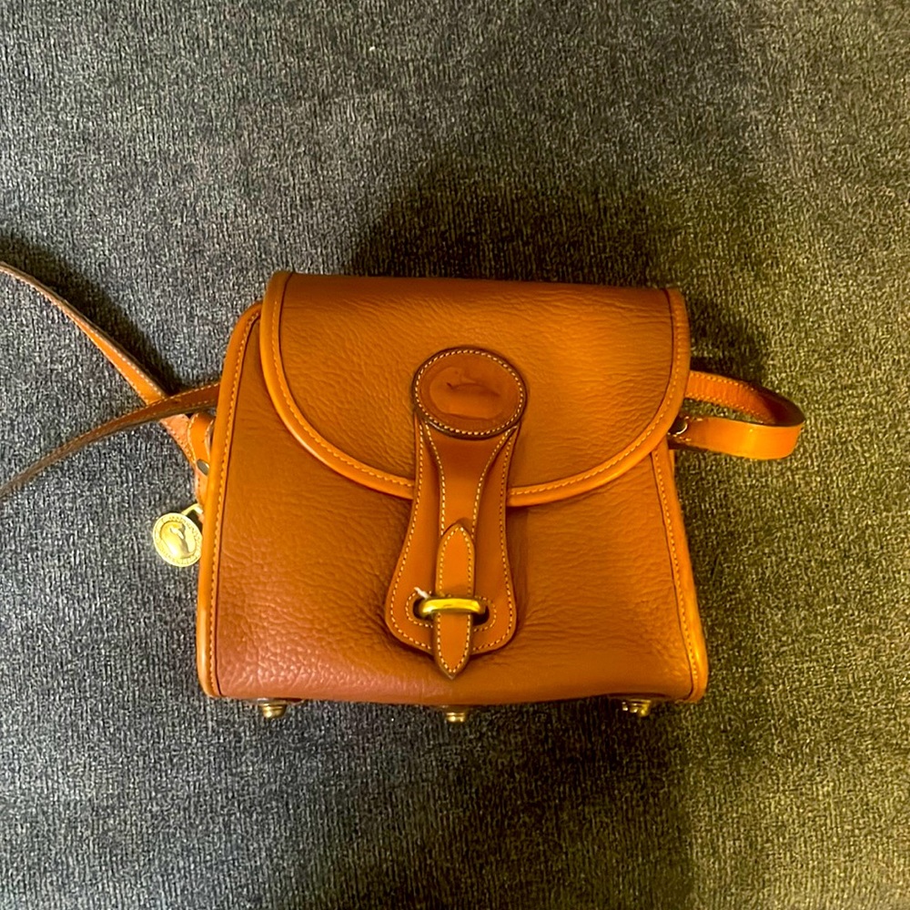 Dooney and Bourke All-weather leather Structured Crossbody bag in warm brown!